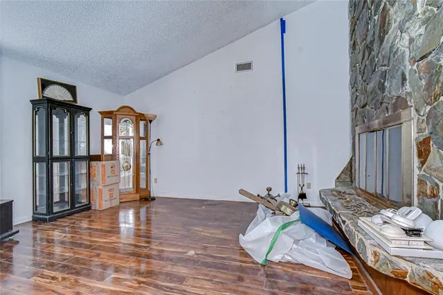 a view of an entryway with wooden floor