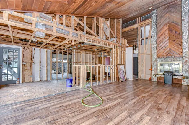 a dining room with furniture and a floor to ceiling window