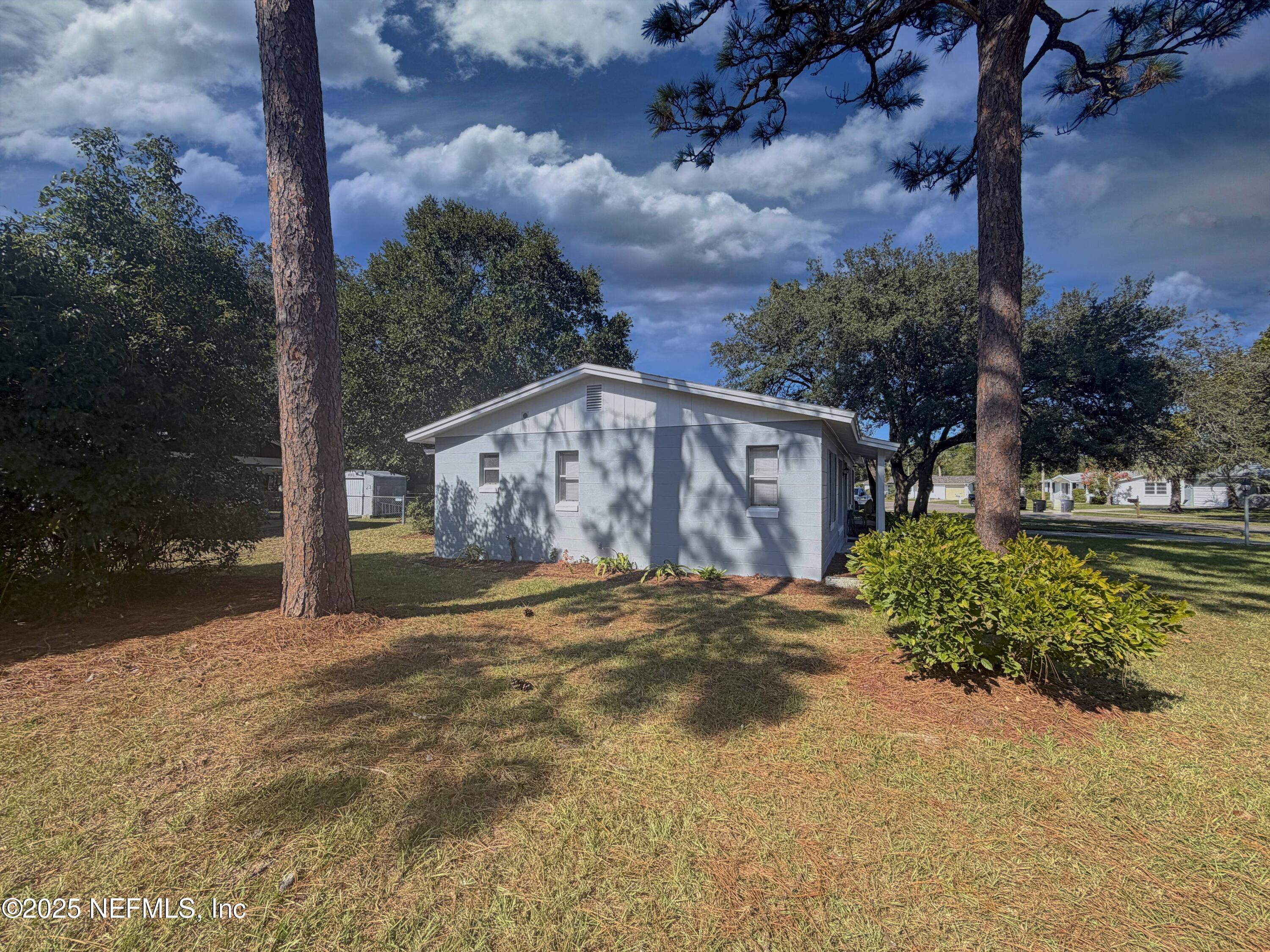 283 Almansa Road St. Augustine, FL 32086 - Photo 16 of 16 a front view of a house with garden