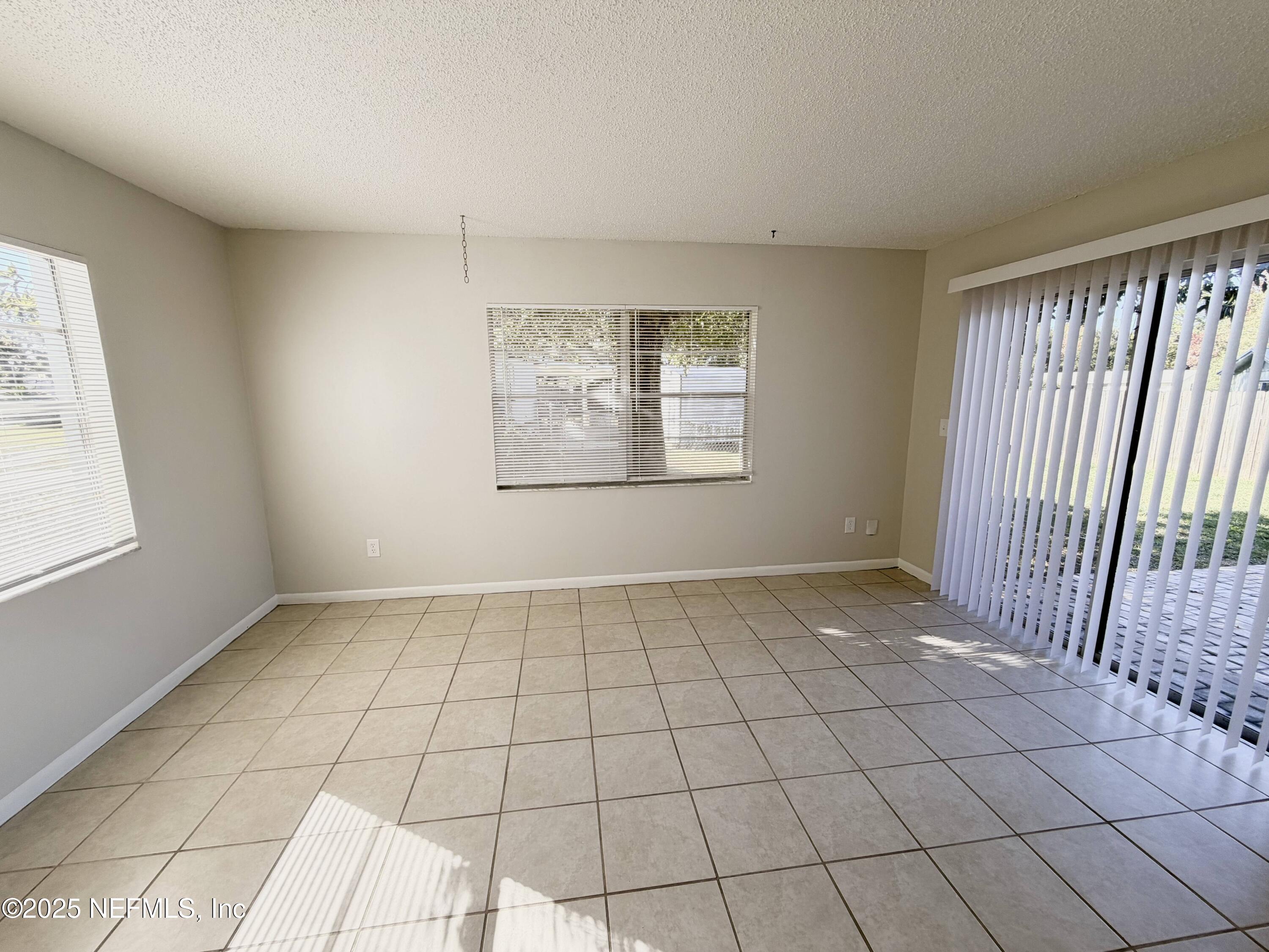 283 Almansa Road St. Augustine, FL 32086 - Photo 4 of 16 a view of an empty room and window