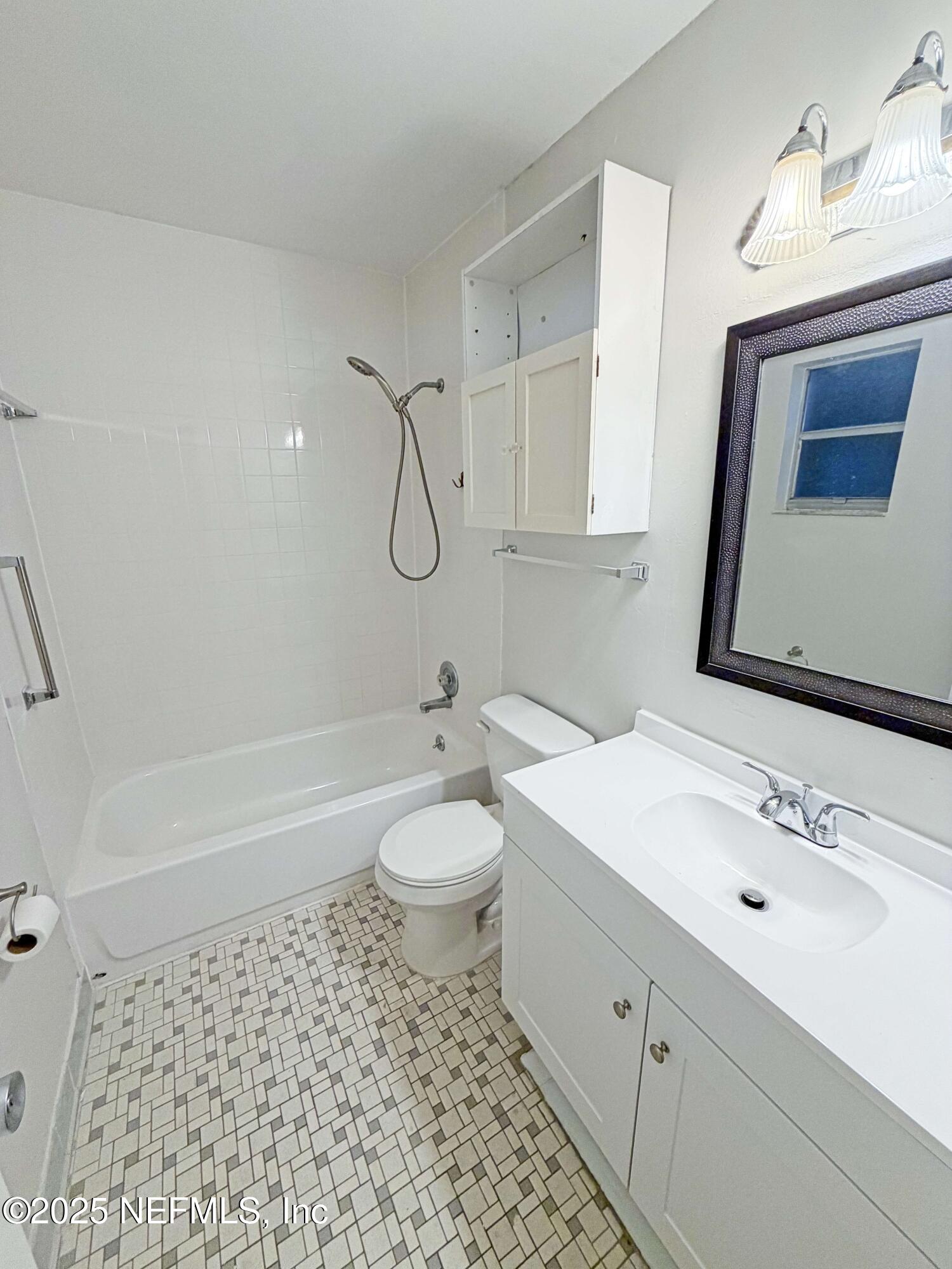 283 Almansa Road St. Augustine, FL 32086 - Photo 10 of 16 a bathroom with a sink a toilet and shower