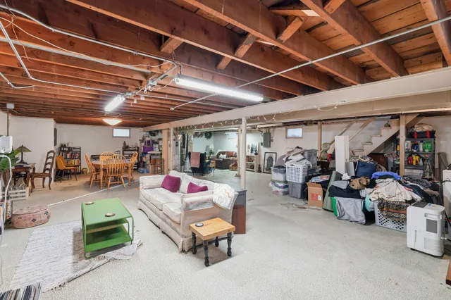 a living room with lots of furniture and a gym