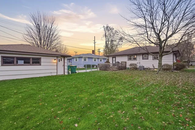 a view of a house with a back yard