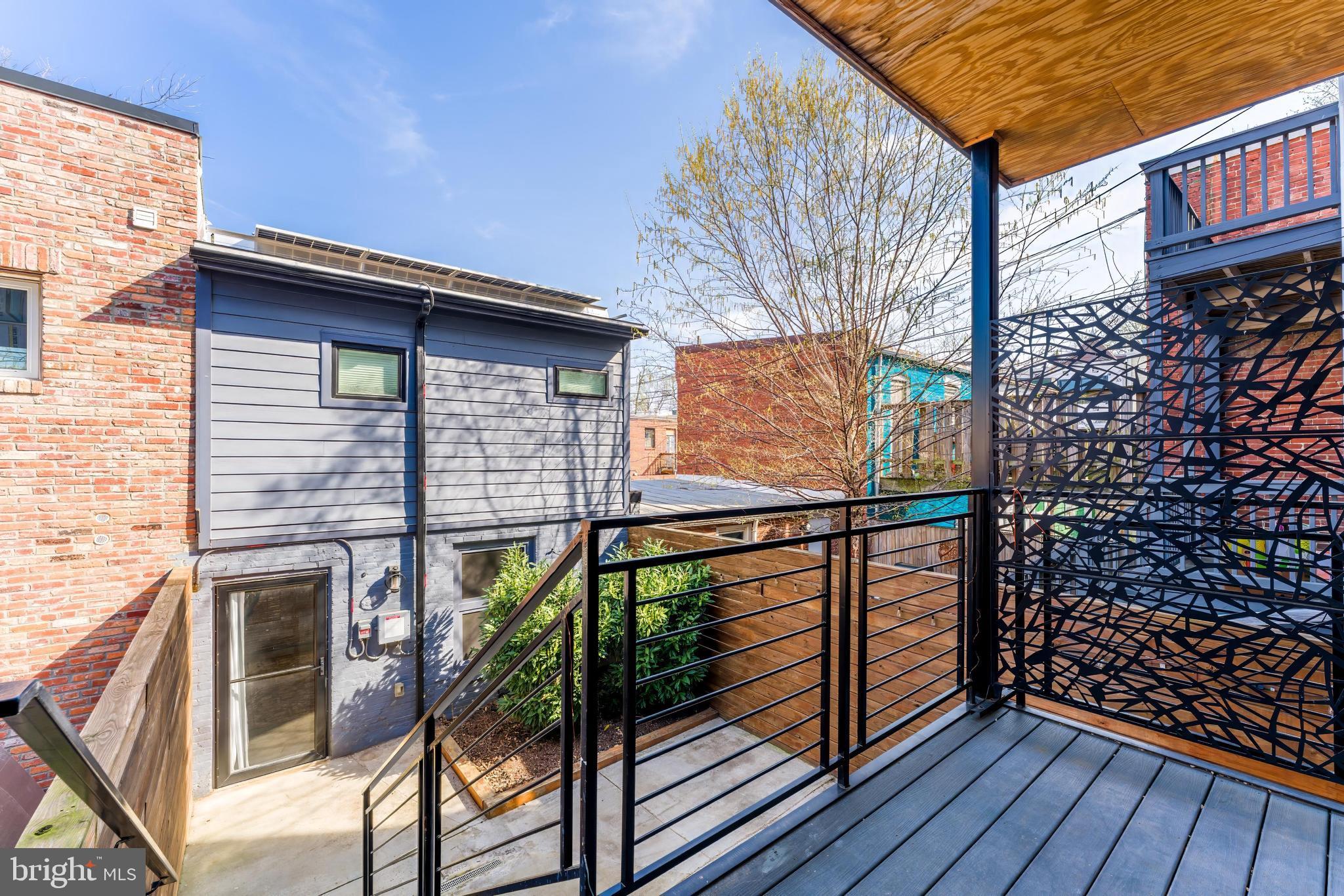 648 F Street Northeast Washington, DC 20002 - Photo 12 of 45 PRIVATE REAR DECK AND PATIO WITH CARRIAGE HOUSE