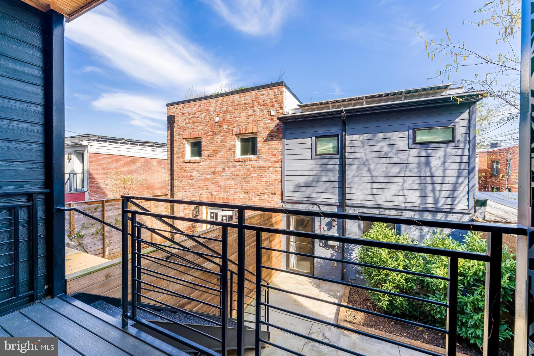 648 F Street Northeast Washington, DC 20002 - Photo 13 of 45 PRIVATE REAR DECK AND PATIO WITH CARRIAGE HOUSE