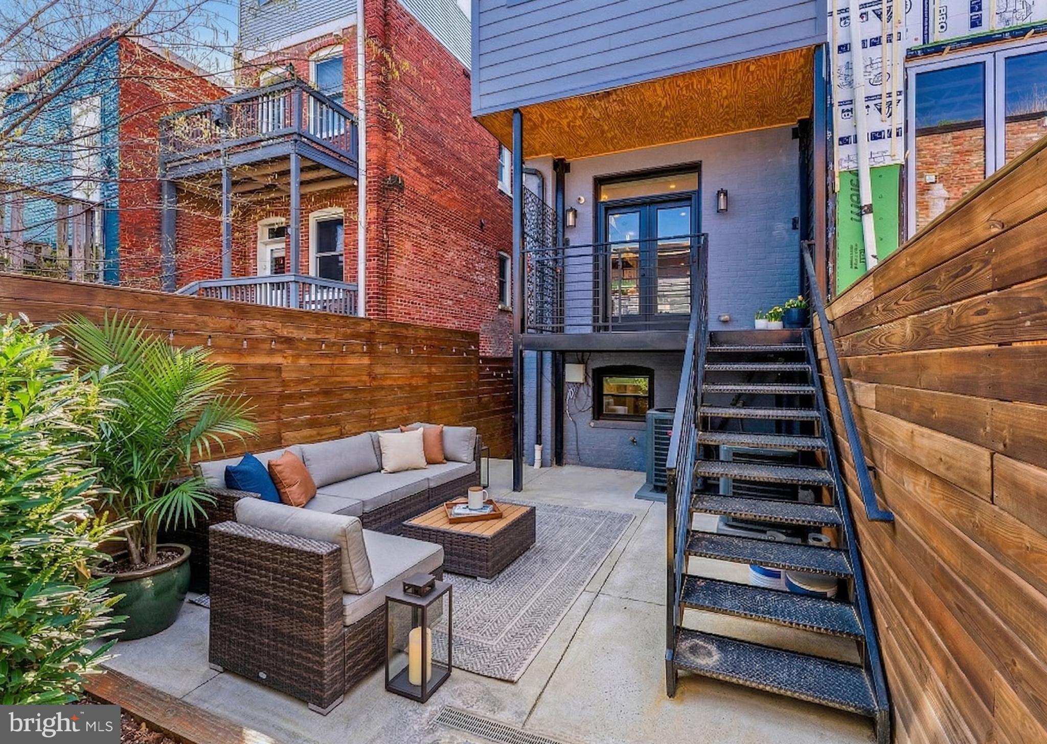 648 F Street Northeast Washington, DC 20002 - Photo 14 of 45 PRIVATE REAR DECK AND PATIO WITH CARRIAGE HOUSE