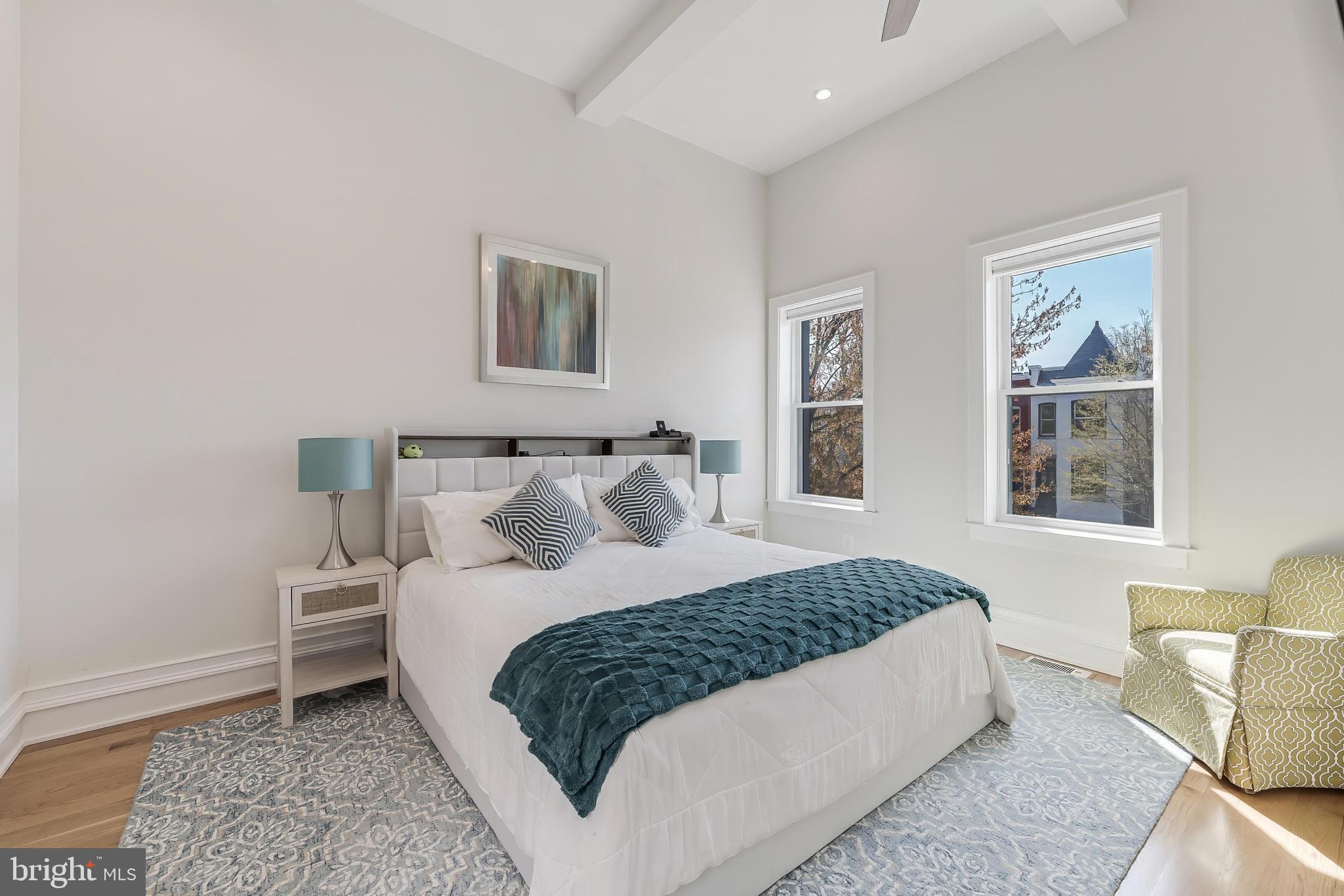 648 F Street Northeast Washington, DC 20002 - Photo 17 of 45 a bedroom with a bed and a couch