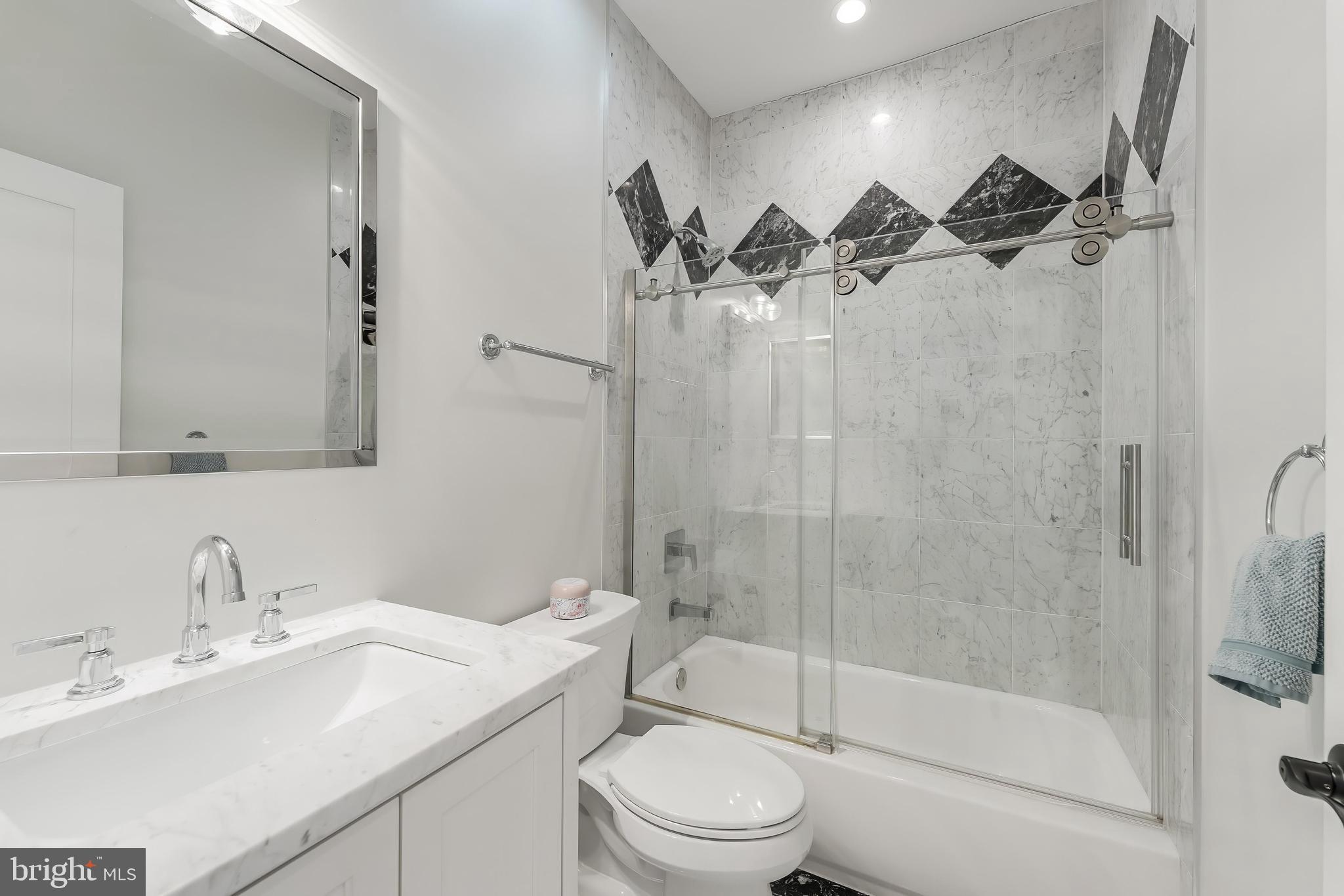 648 F Street Northeast Washington, DC 20002 - Photo 25 of 45 a bathroom with a sink toilet and shower