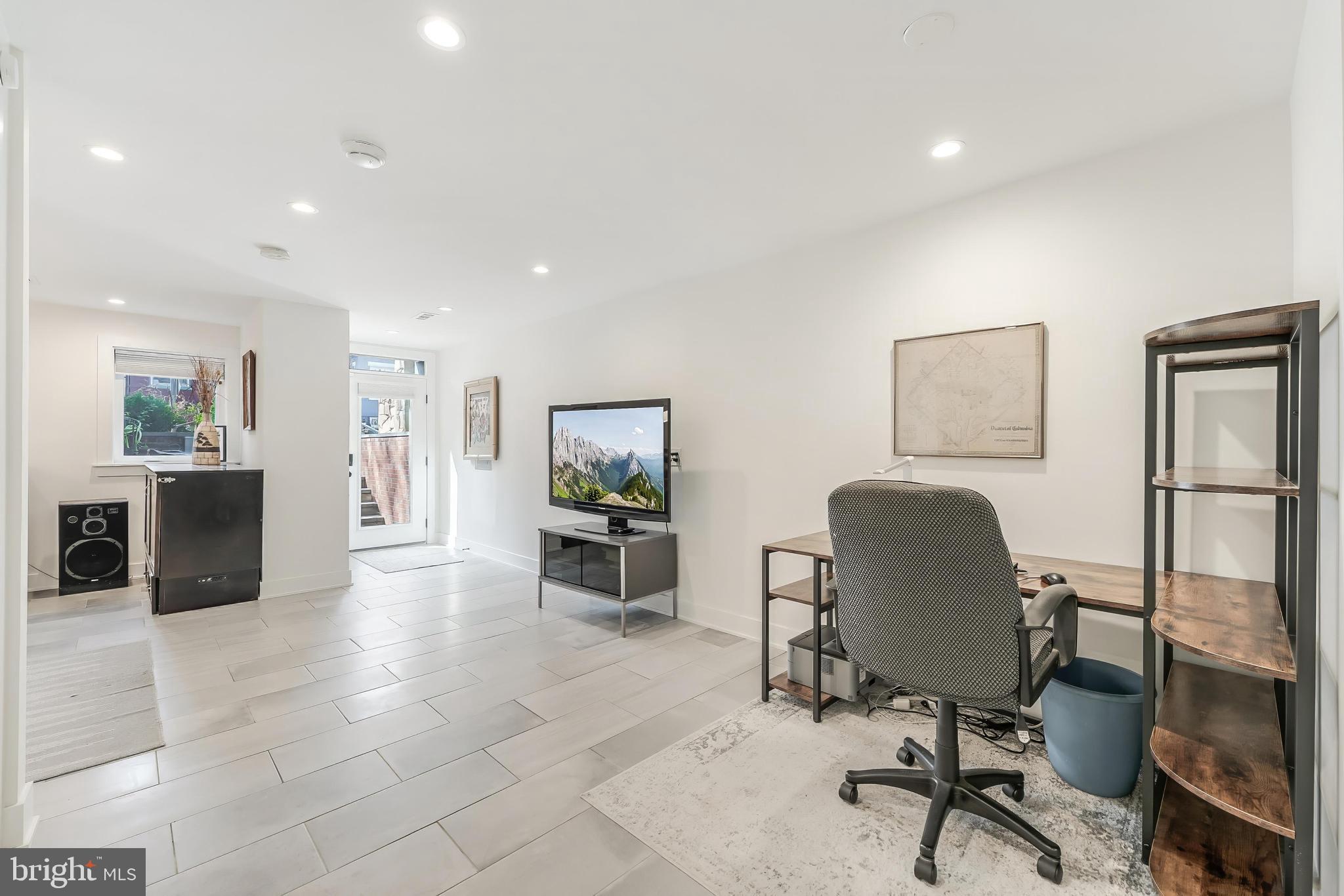 648 F Street Northeast Washington, DC 20002 - Photo 26 of 45 a living room with furniture and a flat screen tv