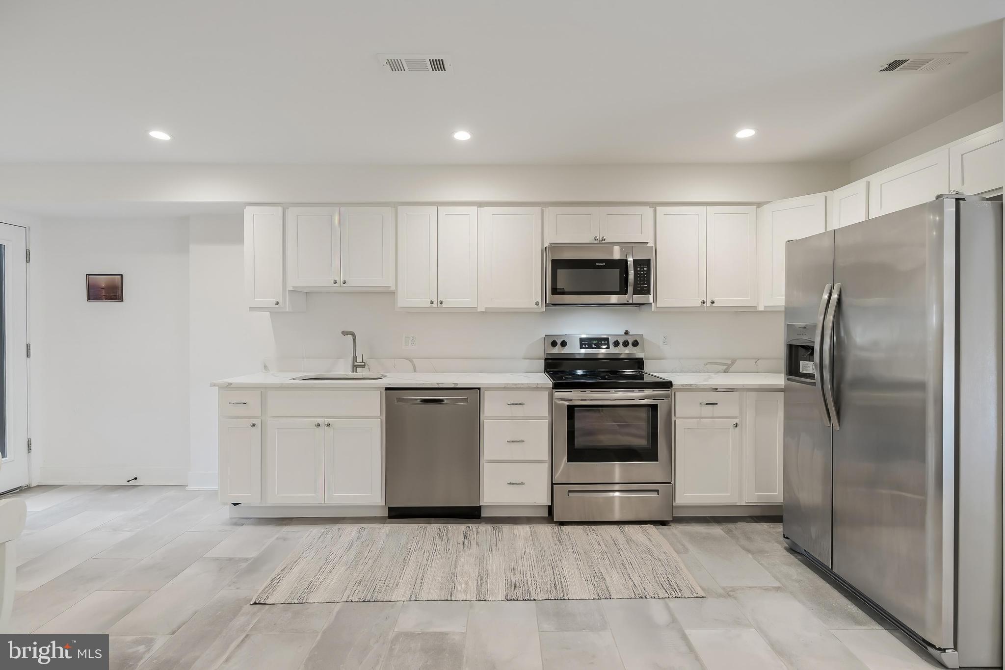648 F Street Northeast Washington, DC 20002 - Photo 33 of 45 LOWER LEVEL KITCHEN WITH TABLE SPACE