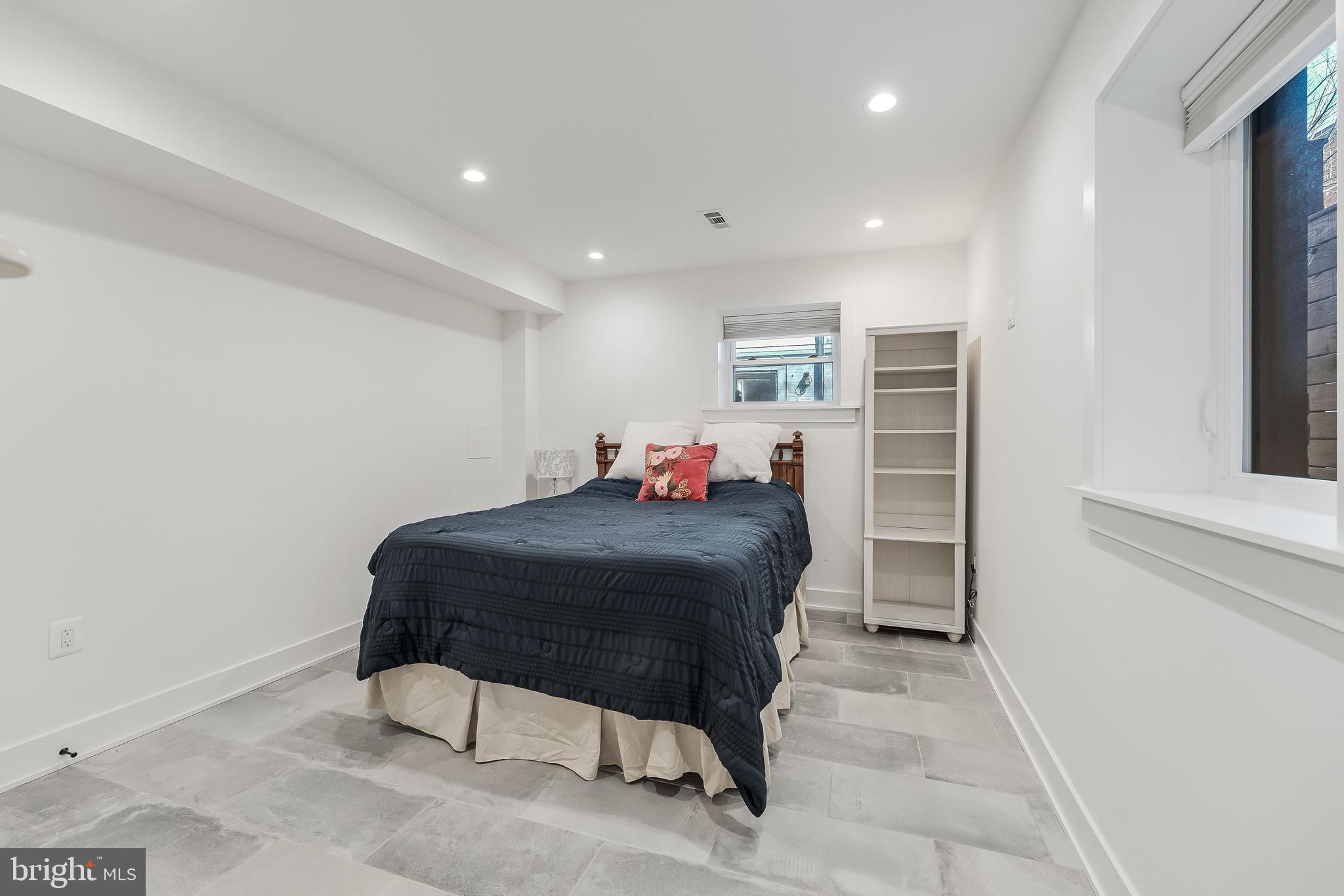 648 F Street Northeast Washington, DC 20002 - Photo 34 of 45 a bed room with a bed and a chair