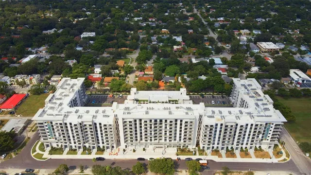 a view of a patio with table and chairs