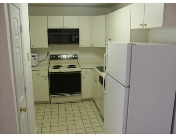 80 Wingate Street, Unit 2F Haverhill, MA 01832 - Photo 3 of 3 a kitchen with a stove and a refrigerator