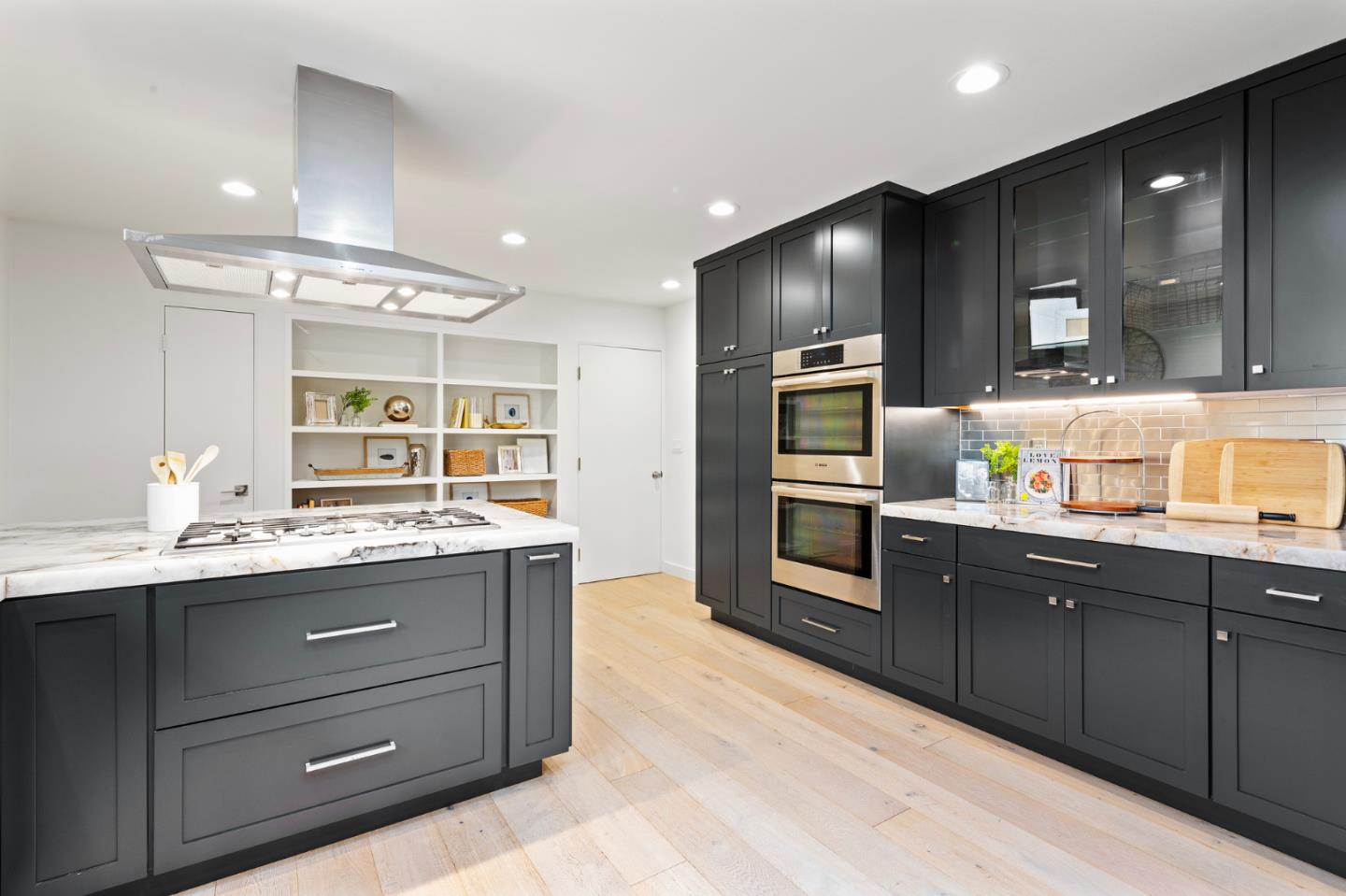 721 Occidental Avenue San Mateo, CA 94402 - Photo 18 of 60 a kitchen with granite countertop stainless steel appliances and wooden cabinets