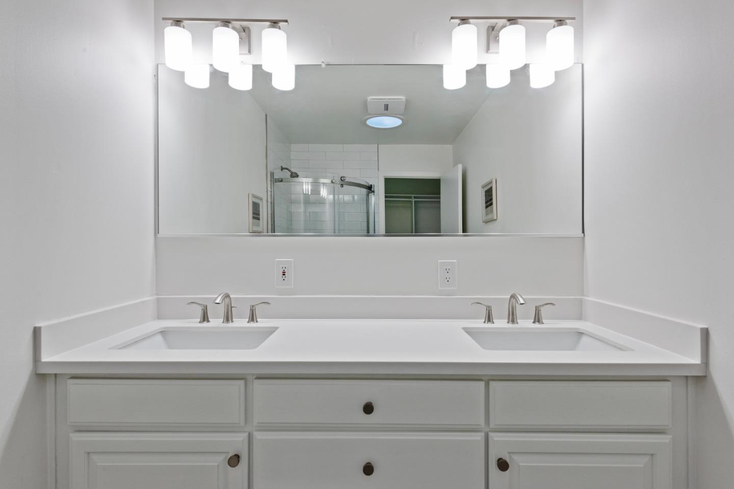 721 Occidental Avenue San Mateo, CA 94402 - Photo 31 of 60 a bathroom with a sink double vanity and a mirror