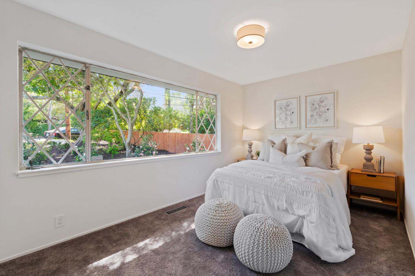 721 Occidental Avenue San Mateo, CA 94402 - Photo 36 of 60 a bedroom with a bed and a large window