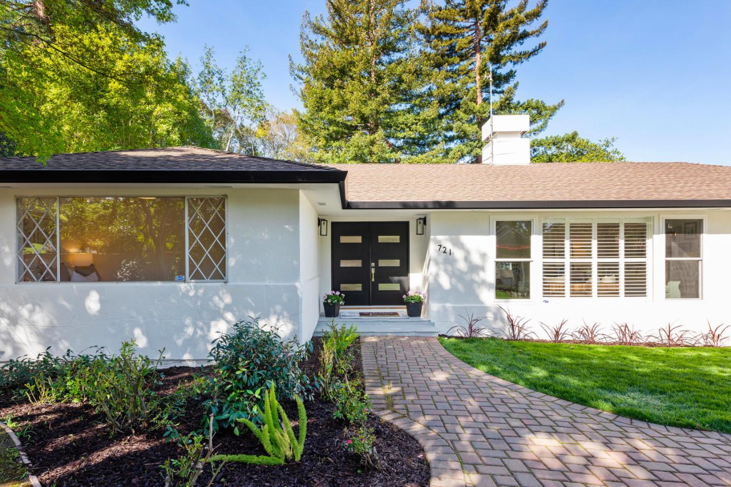 721 Occidental Avenue San Mateo, CA 94402 - Photo 4 of 60 a front view of a house with garden