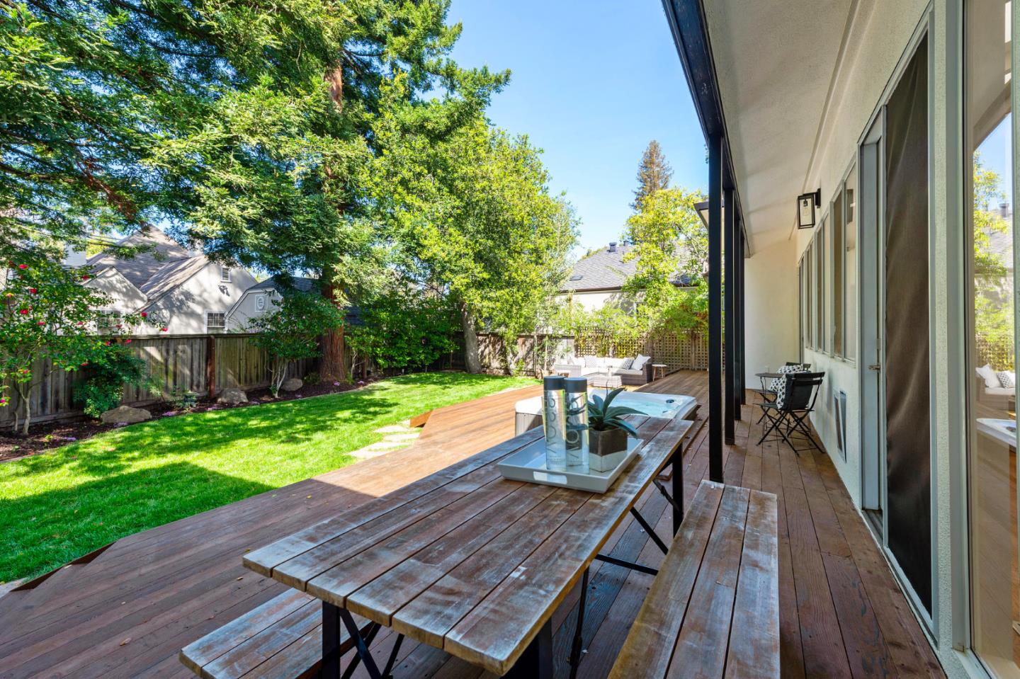 721 Occidental Avenue San Mateo, CA 94402 - Photo 47 of 60 a view of deck with table and chairs and wooden floor