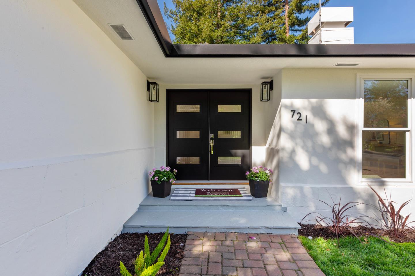 721 Occidental Avenue San Mateo, CA 94402 - Photo 5 of 60 a front view of a house with a garden