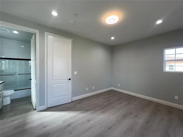 an empty room with a bathroom