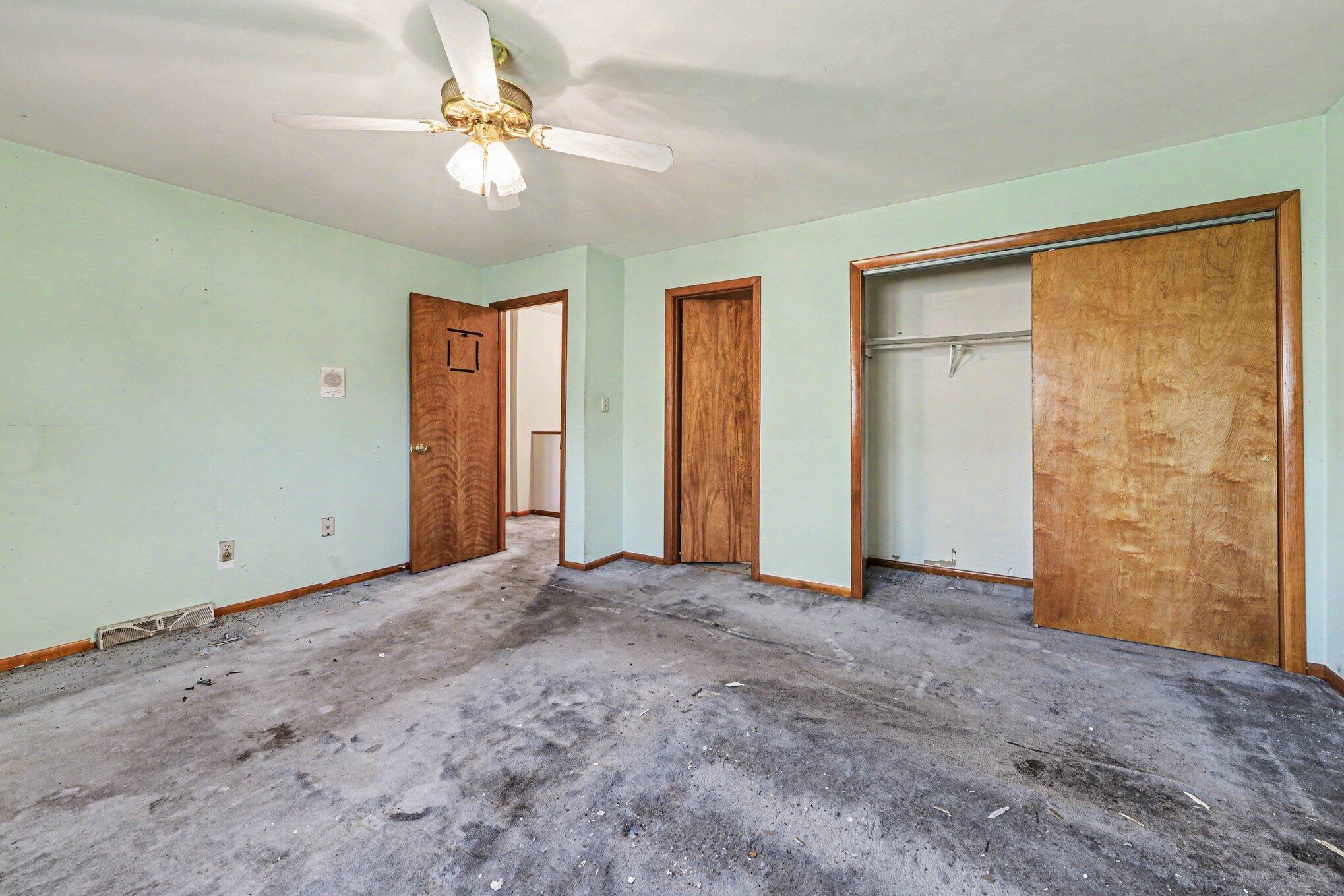 2423 Marshall Place Gary, IN 46404 - Photo 14 of 26 an empty room with closet and a ceiling fan