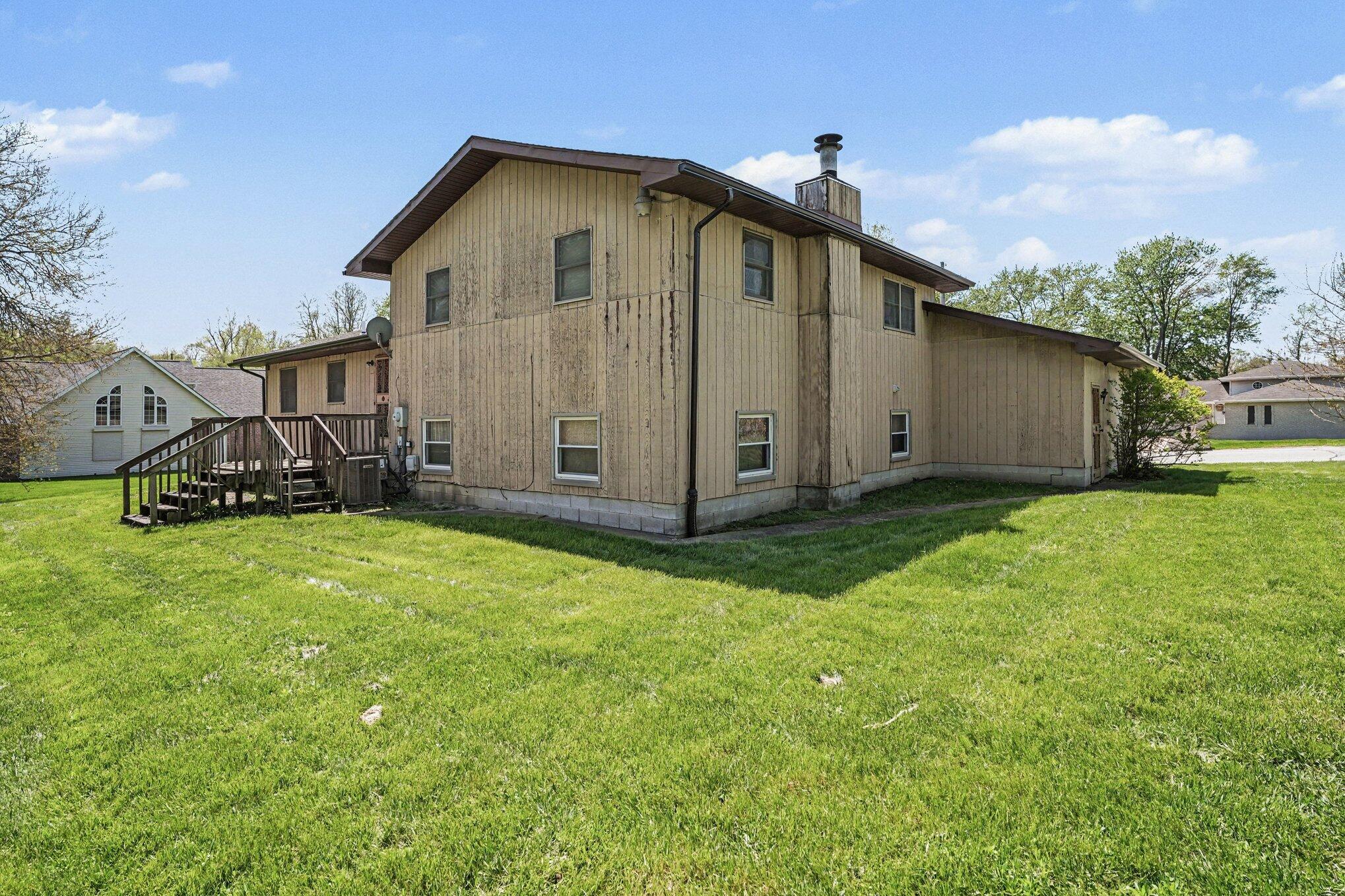 2423 Marshall Place Gary, IN 46404 - Photo 26 of 26 a front view of a house with garden