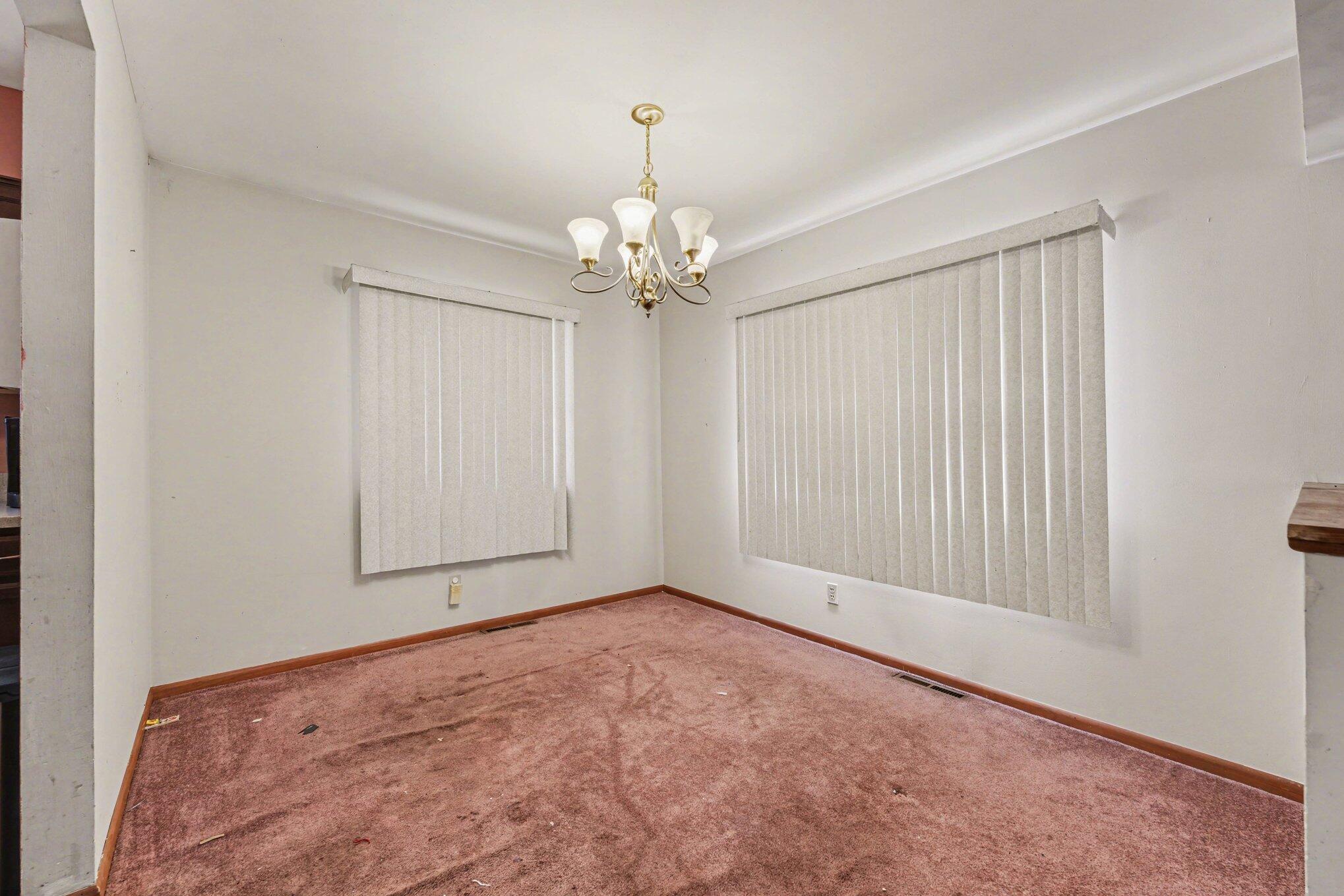 2423 Marshall Place Gary, IN 46404 - Photo 5 of 26 an empty room with chandelier fan