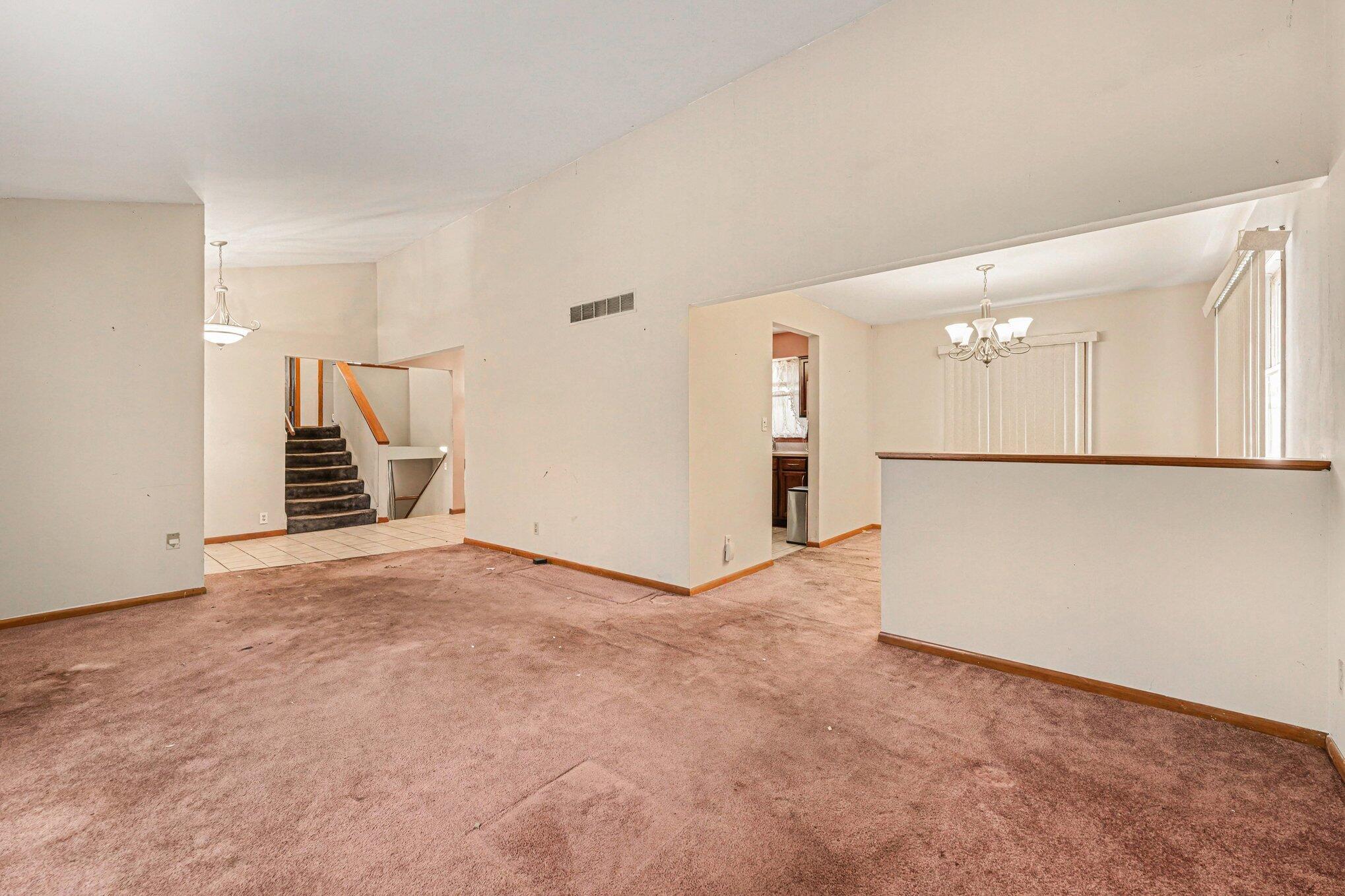 2423 Marshall Place Gary, IN 46404 - Photo 7 of 26 an empty room with a kitchen and a sink