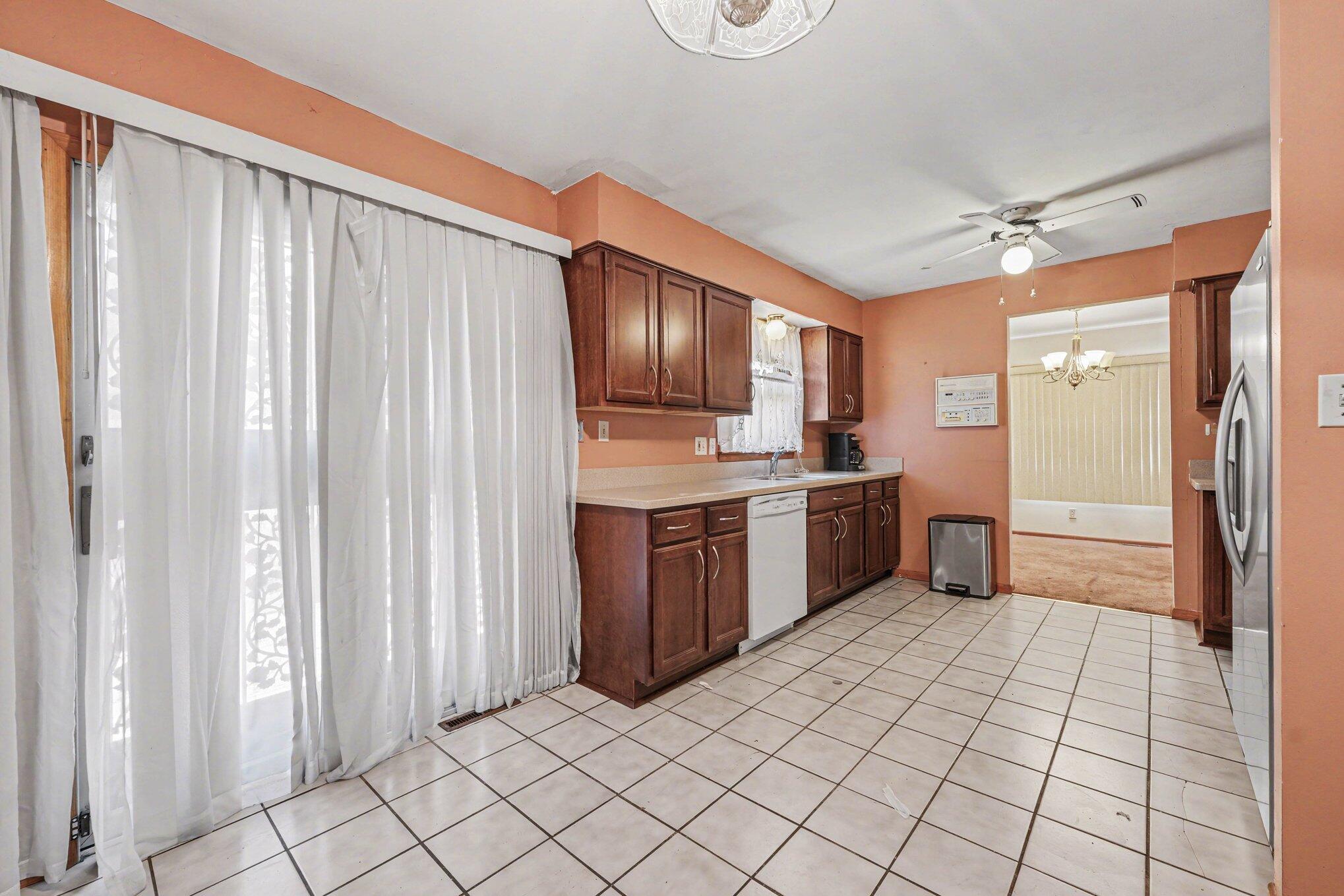 2423 Marshall Place Gary, IN 46404 - Photo 10 of 26 a kitchen with a cabinets and white appliances