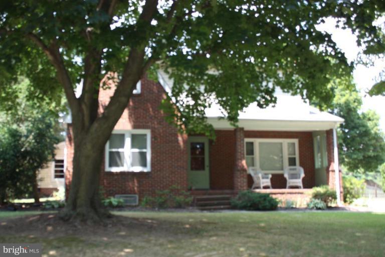 8404 Rocky Springs Road Frederick, MD 21702 - Photo 1 of 26 a front view of a house with a yard