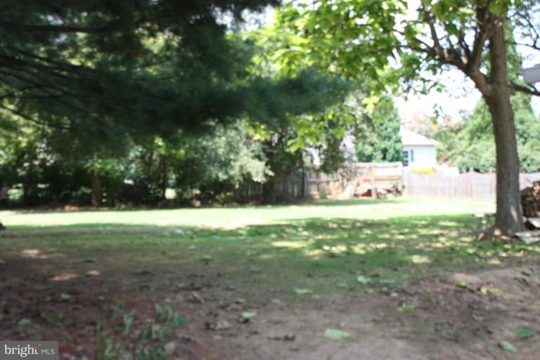 8404 Rocky Springs Road Frederick, MD 21702 - Photo 16 of 26 a view of a yard with large trees