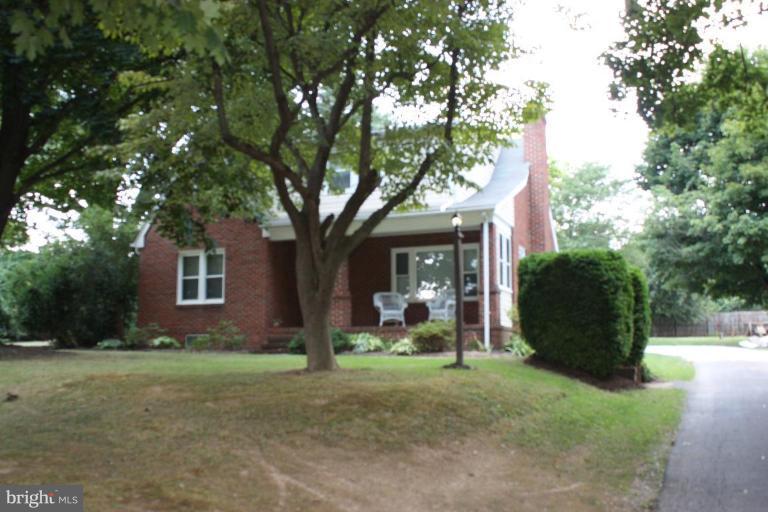 8404 Rocky Springs Road Frederick, MD 21702 - Photo 17 of 26 a view of a house with backyard and trees