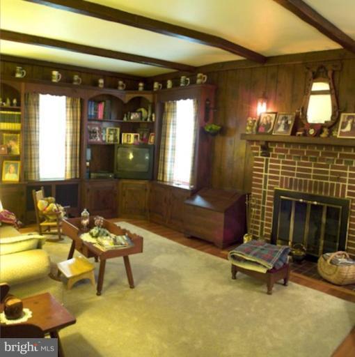 8404 Rocky Springs Road Frederick, MD 21702 - Photo 24 of 26 a living room with patio furniture and a fireplace