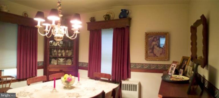 8404 Rocky Springs Road Frederick, MD 21702 - Photo 26 of 26 a view of a dining room with furniture and chandelier