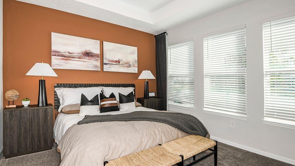 32472 Sea Loch Loop Mount Dora, FL 32757 - Photo 12 of 31 a bedroom with a bed and a large window