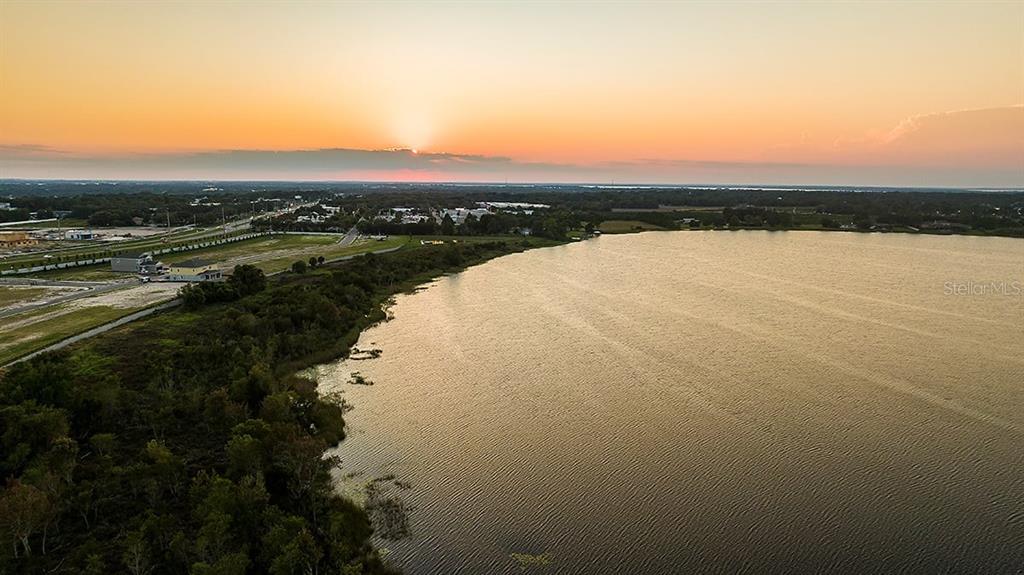 32472 Sea Loch Loop Mount Dora, FL 32757 - Photo 30 of 31 a view of lake with sunset