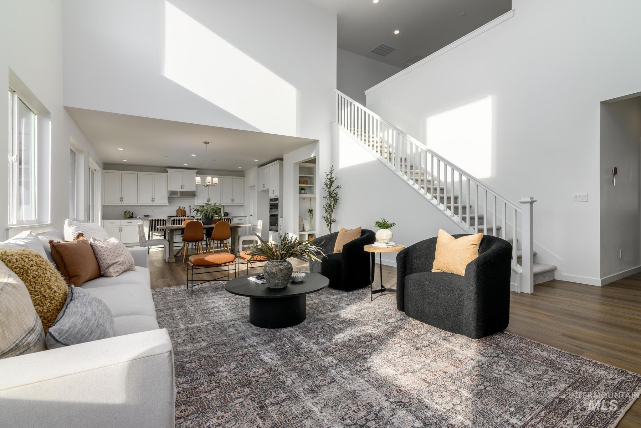 855 West Bay Street Middleton, ID 83644 - Photo 4 of 13 Living room with dark wood-style flooring, a high ceiling, and recessed lighting