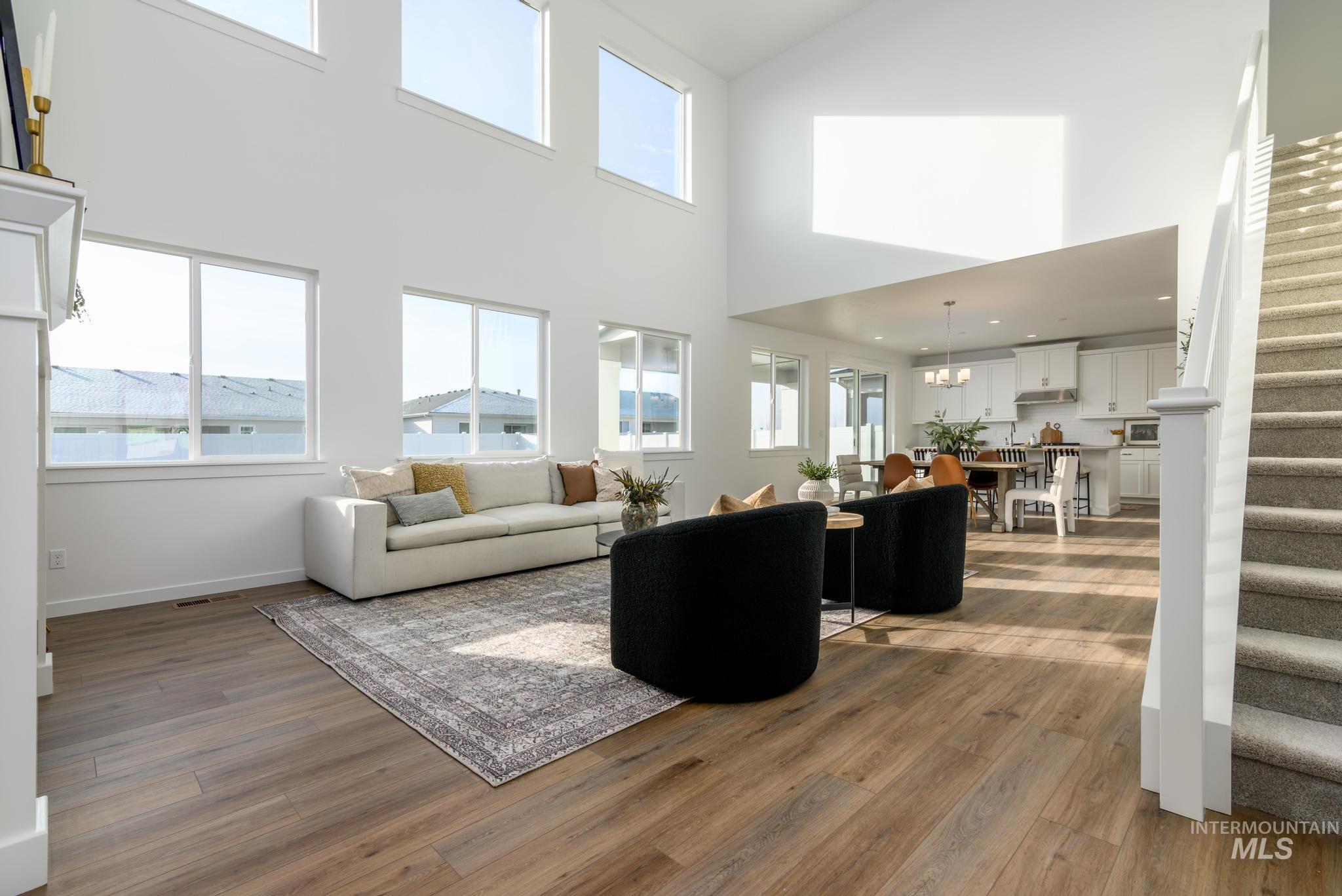 855 West Bay Street Middleton, ID 83644 - Photo 5 of 13 Living area featuring light wood-style flooring and a high ceiling