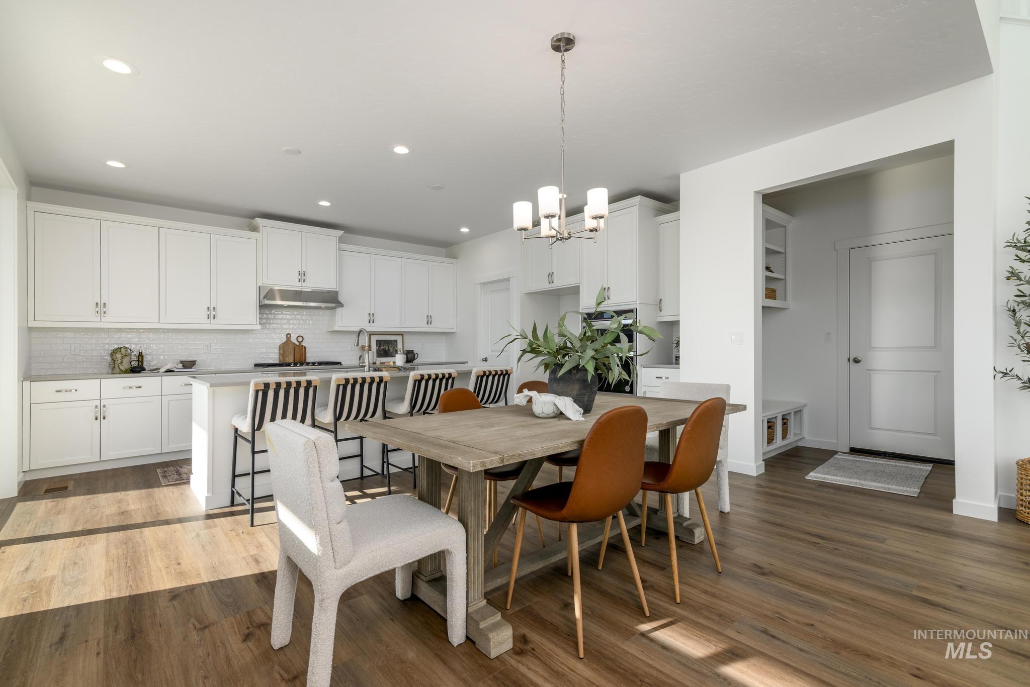 855 West Bay Street Middleton, ID 83644 - Photo 7 of 13 Dining area with dark wood-style floors and suspended lighting