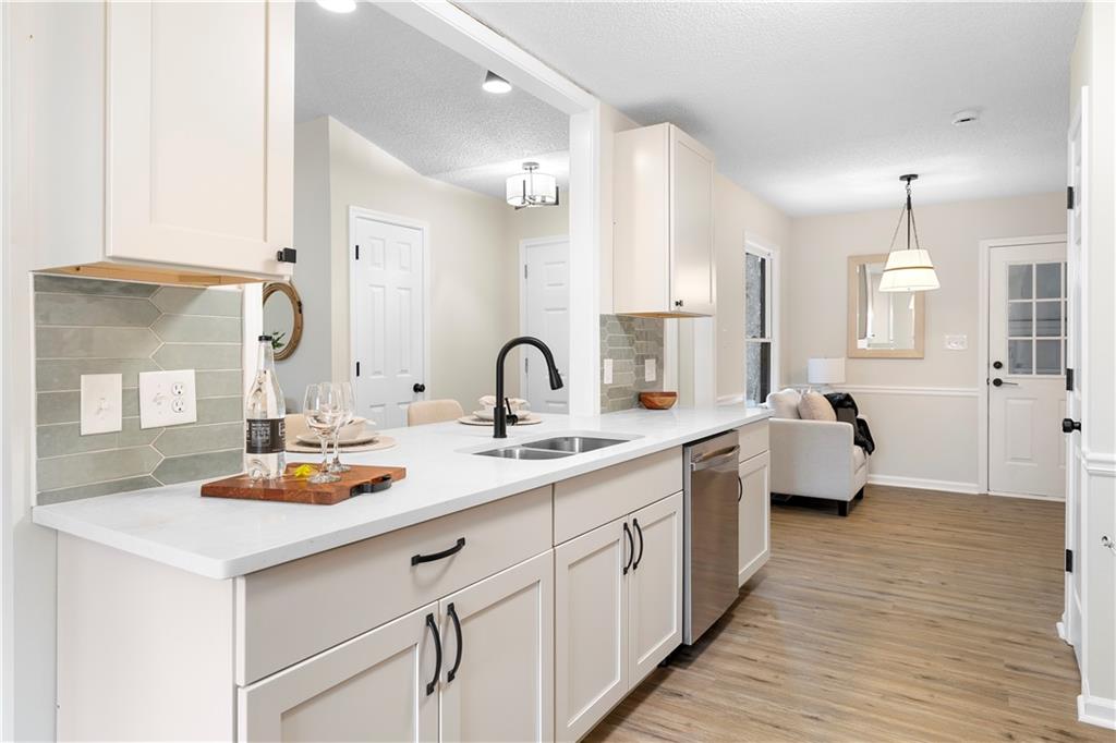 323 Lumpkin Street Winder, GA 30680 - Photo 12 of 30 a spacious bathroom with double vanity sinks and a mirror