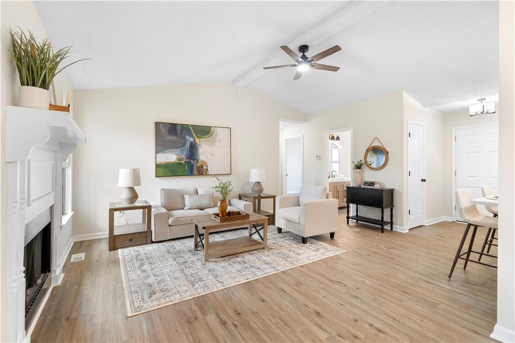 323 Lumpkin Street Winder, GA 30680 - Photo 14 of 30 a living room with furniture and a fireplace