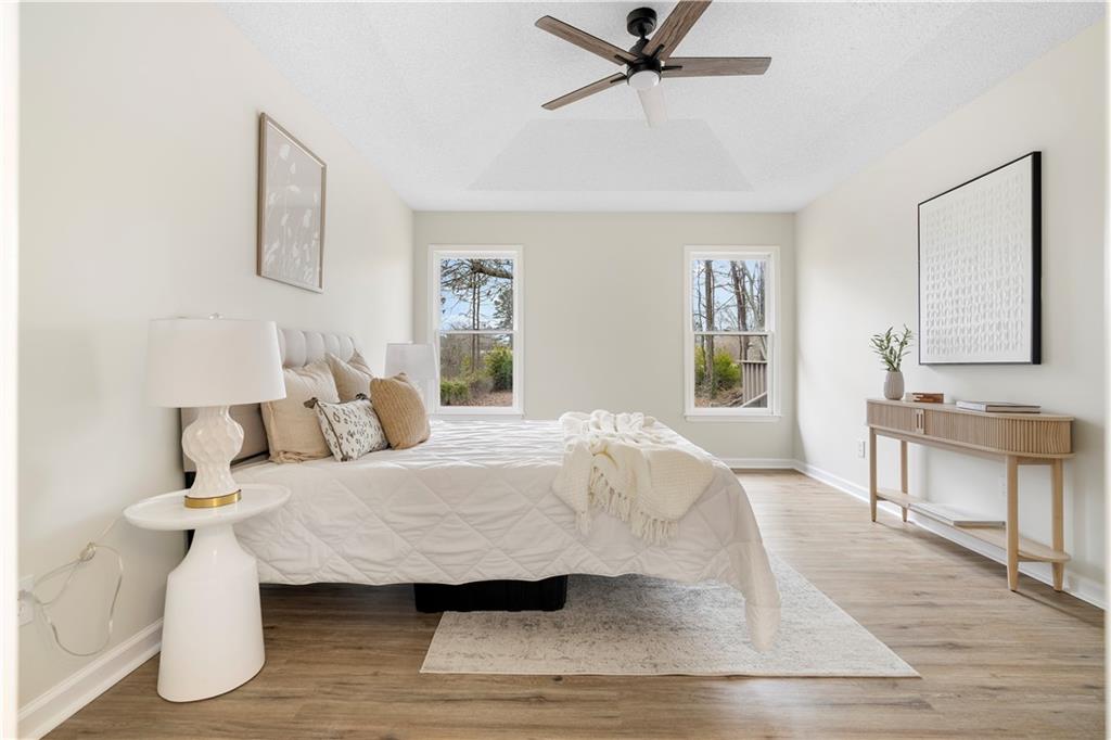 323 Lumpkin Street Winder, GA 30680 - Photo 17 of 30 a bedroom with a bed and a table