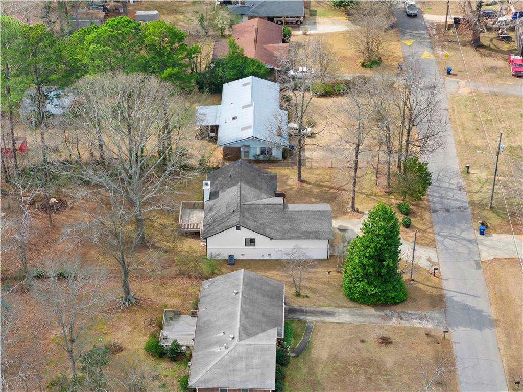 323 Lumpkin Street Winder, GA 30680 - Photo 29 of 30 an aerial view of residential houses with outdoor space