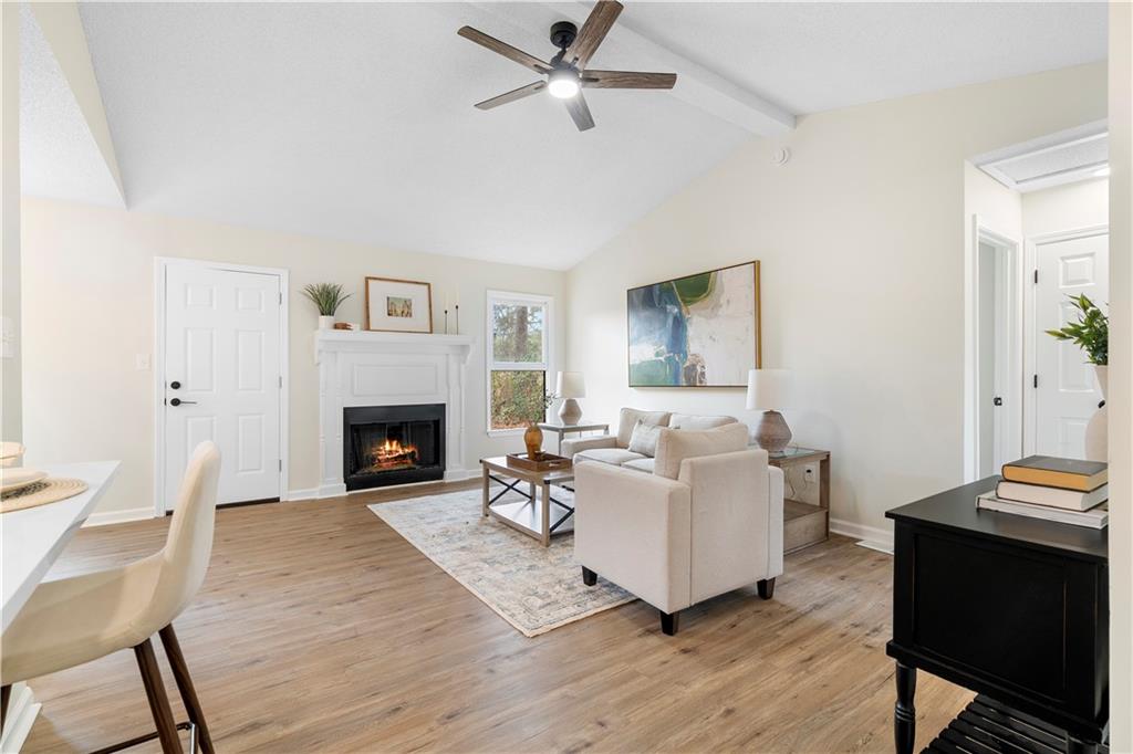 323 Lumpkin Street Winder, GA 30680 - Photo 4 of 30 a living room with furniture and a fireplace