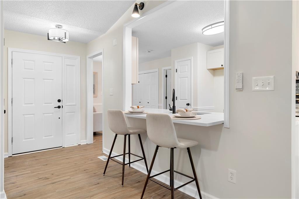 323 Lumpkin Street Winder, GA 30680 - Photo 8 of 30 a bathroom with a sink and a mirror