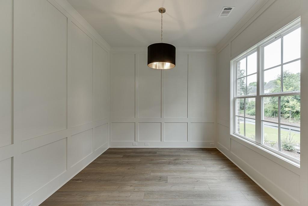 314 Level Creek Road Sugar Hill, GA 30518 - Photo 5 of 62 a view of a room with wooden floor and white walls