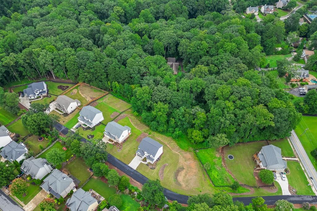 314 Level Creek Road Sugar Hill, GA 30518 - Photo 56 of 62 an aerial view of a house a yard and lake view