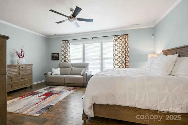 a bedroom with a bed and a couch