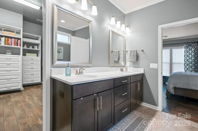 a bathroom with a sink double vanity and a mirror