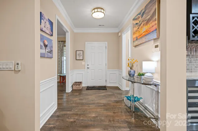 a view of an entryway with wooden floor